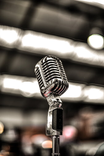 Vintage Microphone on Stage with Blurred Background