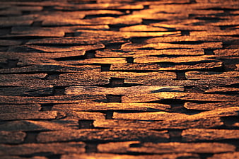 Golden Hour Illuminated Cobblestone Street Texture Close Up