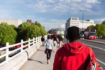 Man in Red Hoodie Walking on London Bridge