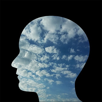 Human Head Silhouette Filled with Blue Sky and Clouds