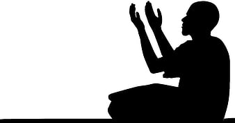 Silhouette of man praying with hands raised