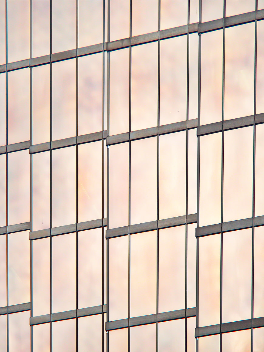 Abstract Modern Glass Building Facade with Pink Reflections