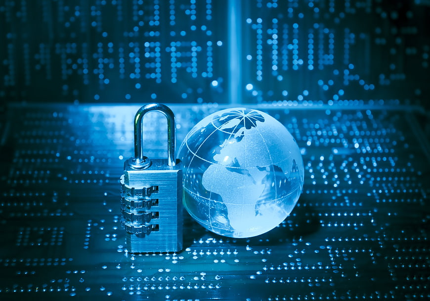 Cybersecurity Concept with Combination Lock and Glass Globe on Circuit Board