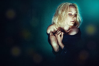 Cinematic Portrait of a Blonde Woman in Dark Teal Atmosphere