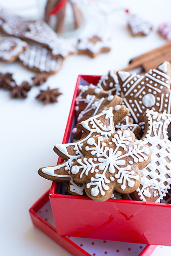 Traditional Christmas gingerbread cookies in a red gift box