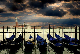 Dramatic Venice Skyline with Gondolas at Sunset