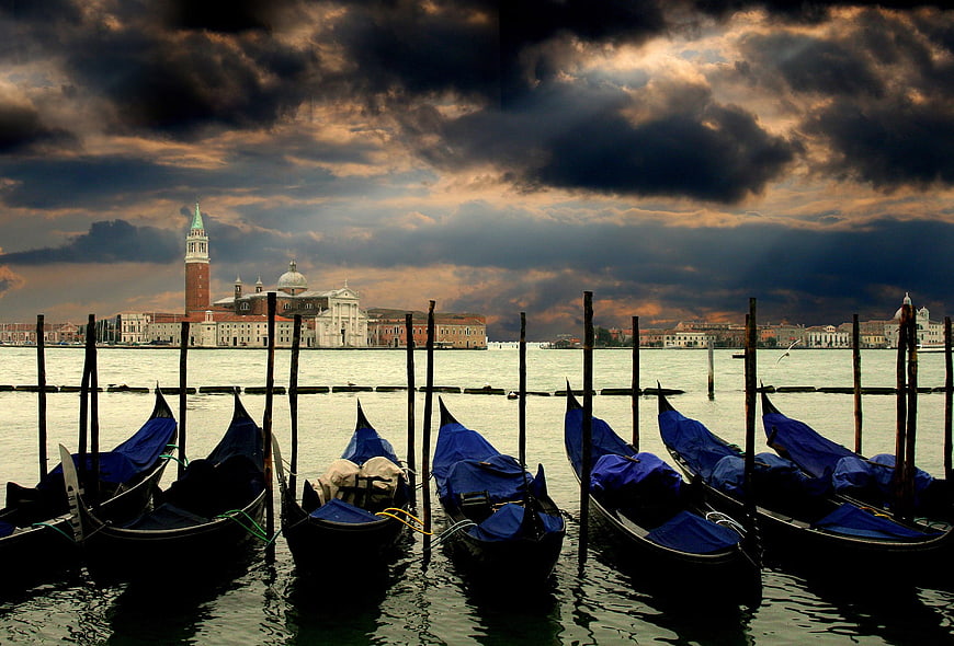 Dramatic Venice Skyline with Gondolas at Sunset