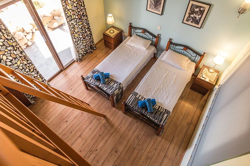 High Angle View of Twin Bedroom with Wooden Floors