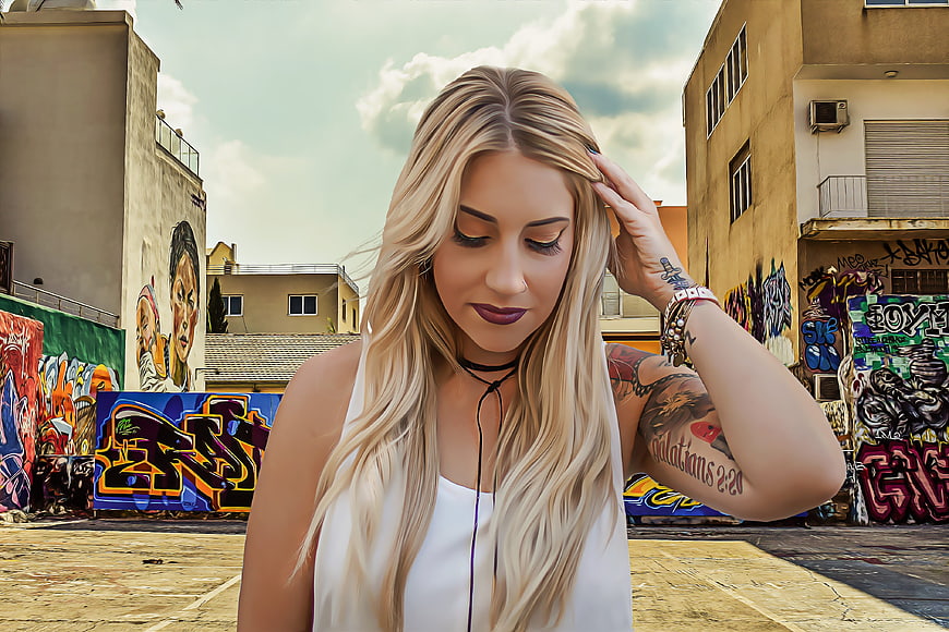 Blonde Tattooed Woman in Urban Graffiti Setting