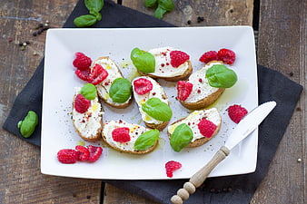 Raspberry and Basil Bruschetta on White Plate