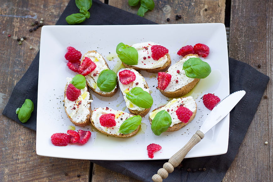 Raspberry and Basil Bruschetta on White Plate