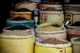 Colorful sacks of dried beans and legumes at a market