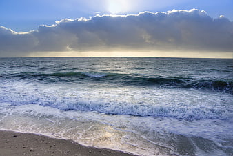 Dramatic Seascape with Breaking Waves and Cloudy Sky