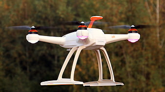 White Chroma Drone Flying with Glowing Lights
