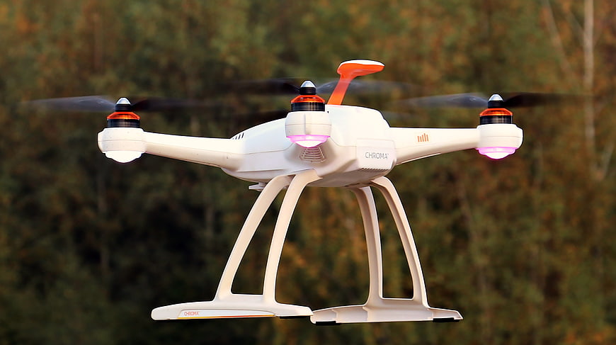 White Chroma Drone Flying with Glowing Lights