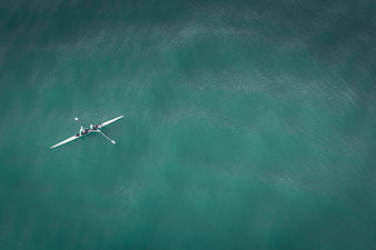 Aerial view of rowing boat on turquoise water