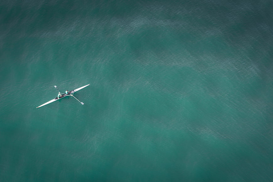 Aerial view of rowing boat on turquoise water