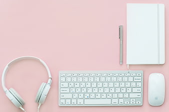 Minimalist Pink Workspace with White Keyboard and Headphones