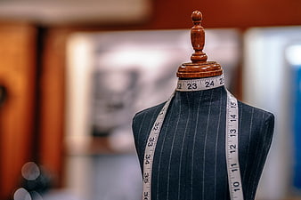 Tailor's Mannequin With Measuring Tape In Pinstripe Fabric