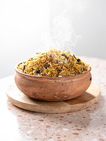 Steaming Biryani Rice in Traditional Clay Pot