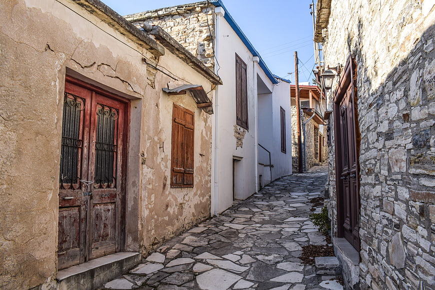 Narrow cobblestone alley in traditional Mediterranean village