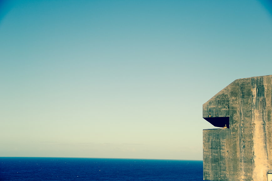 Concrete Watchtower Overlooking Blue Ocean Horizon