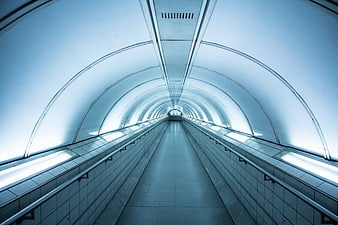 Futuristic Blue Underground Tunnel with Symmetrical Lighting