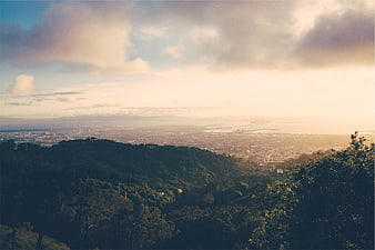 Scenic Sunrise View Over City and Hills