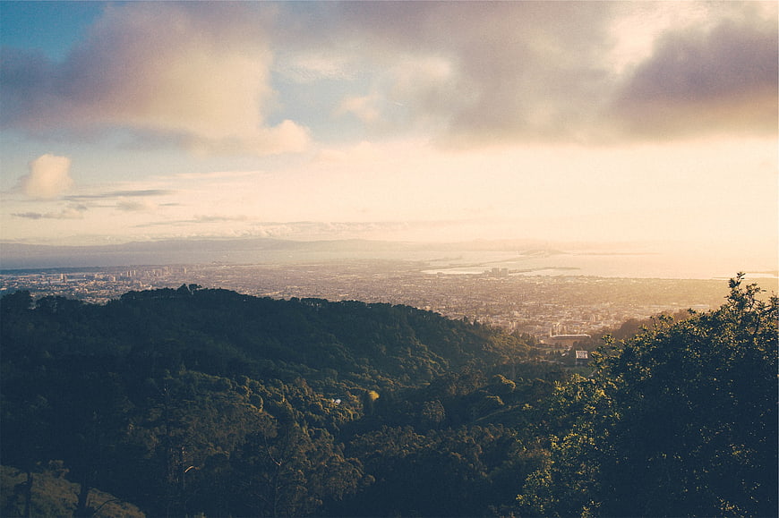 Scenic Sunrise View Over City and Hills