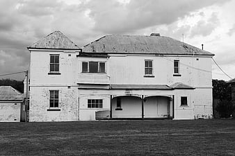 Weathered White Building Exterior in Black and White