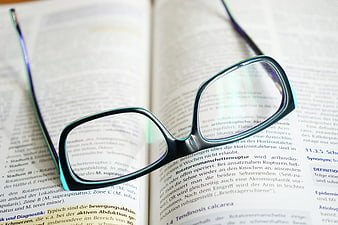 Black Eyeglasses on Open Medical Textbook