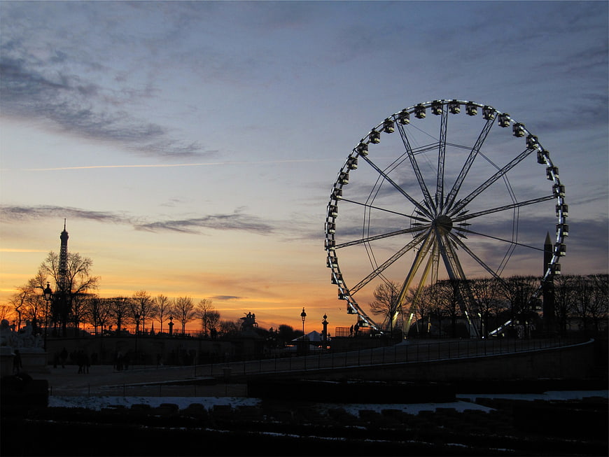 Ferris Wheel and Eiffel Tower Silhouette at Sunset
