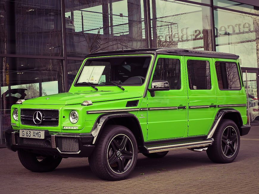 Vibrant Green Mercedes-AMG G 63 SUV Parked Outside Dealership