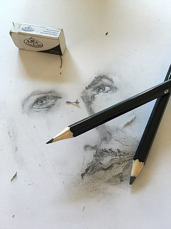 Pencil sketch of a man's face with drawing tools