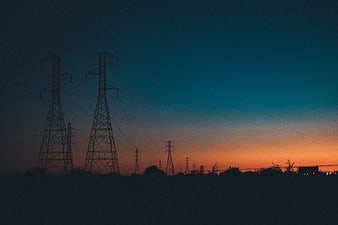 Silhouette of Power Lines Against a Colorful Sunset Sky