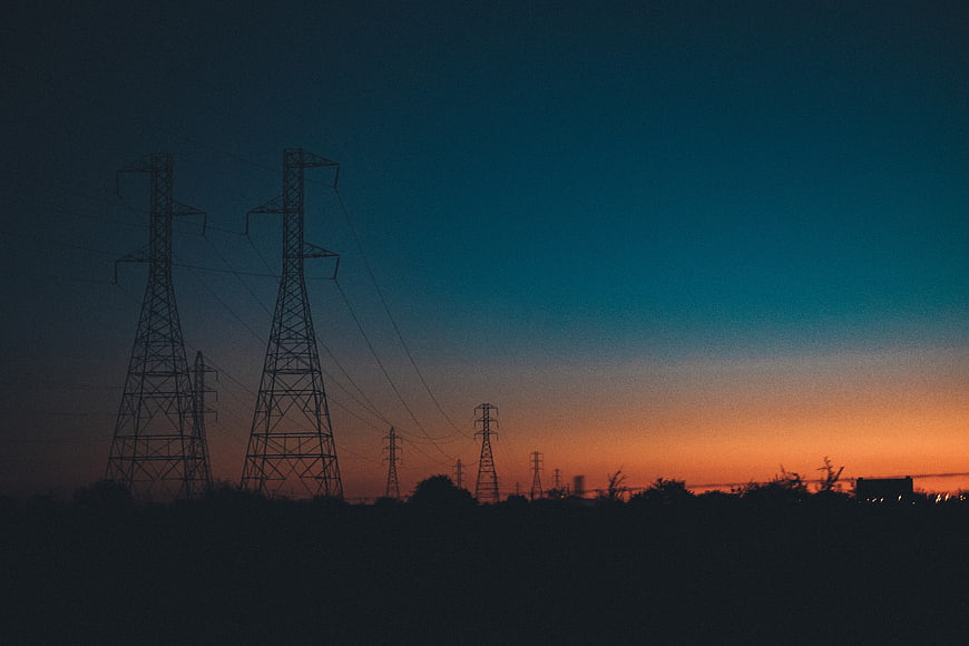 Silhouette of Power Lines Against a Colorful Sunset Sky