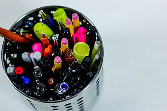 Top View of Colorful Pens and Markers in Metal Cup