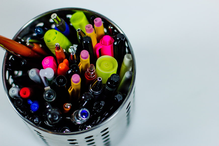 Top View of Colorful Pens and Markers in Metal Cup