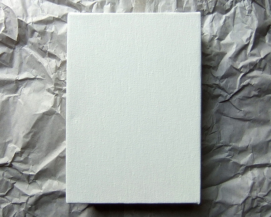 Blank White Canvas on Crumpled Gray Paper Background