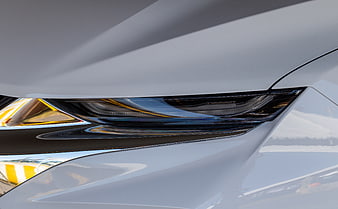 Close-up of modern white car headlight design detail
