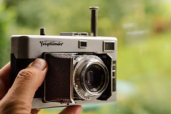 Hand Holding Vintage Voigtländer Film Camera