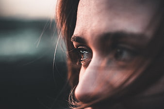 Close-up of Woman's Eye with Windblown Hair