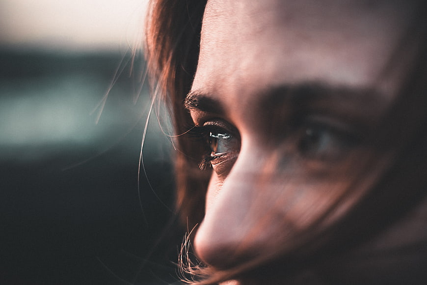 Close-up of Woman's Eye with Windblown Hair
