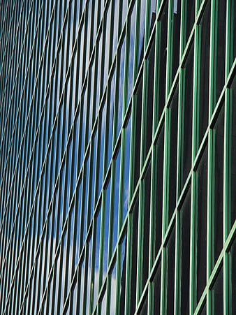 Abstract Green Glass Building Facade with Blue Sky Reflection
