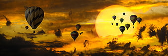 Hot Air Balloons Flying Over Ocean at Golden Sunset