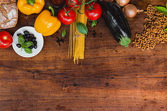Italian pasta ingredients flat lay on rustic wooden table