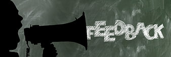 Silhouette of person shouting feedback through megaphone on chalkboard