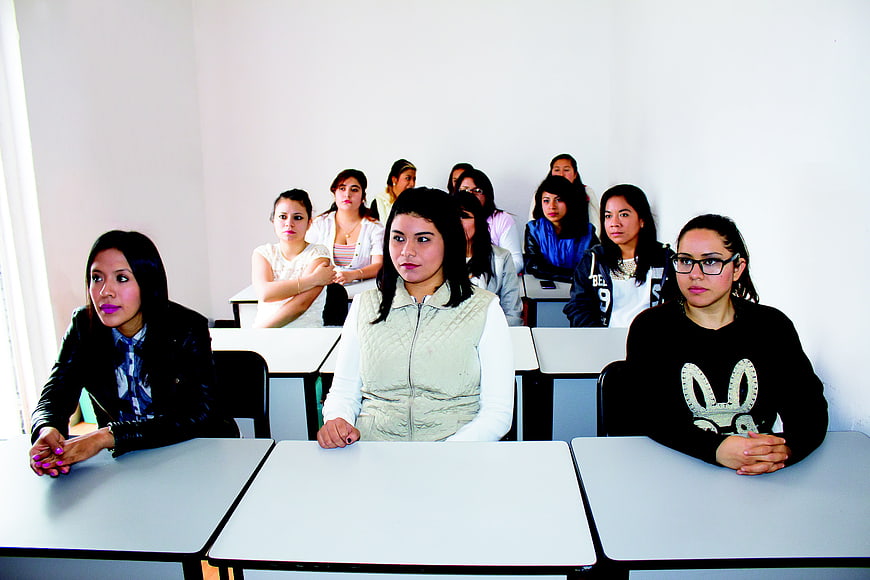 Group of female students sitting in a classroom