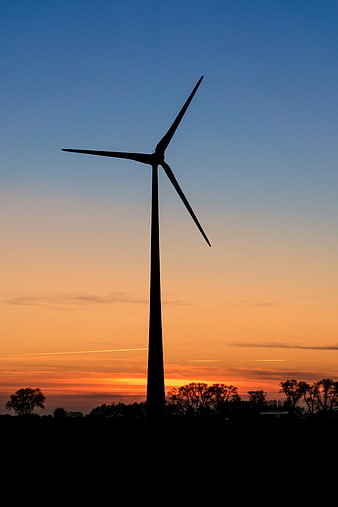 Wind Turbine Silhouette Against Vibrant Sunset Sky