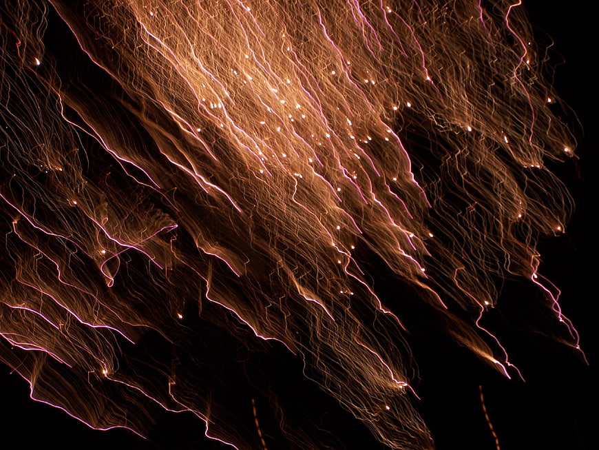 Abstract Fireworks Light Trails on Black Background